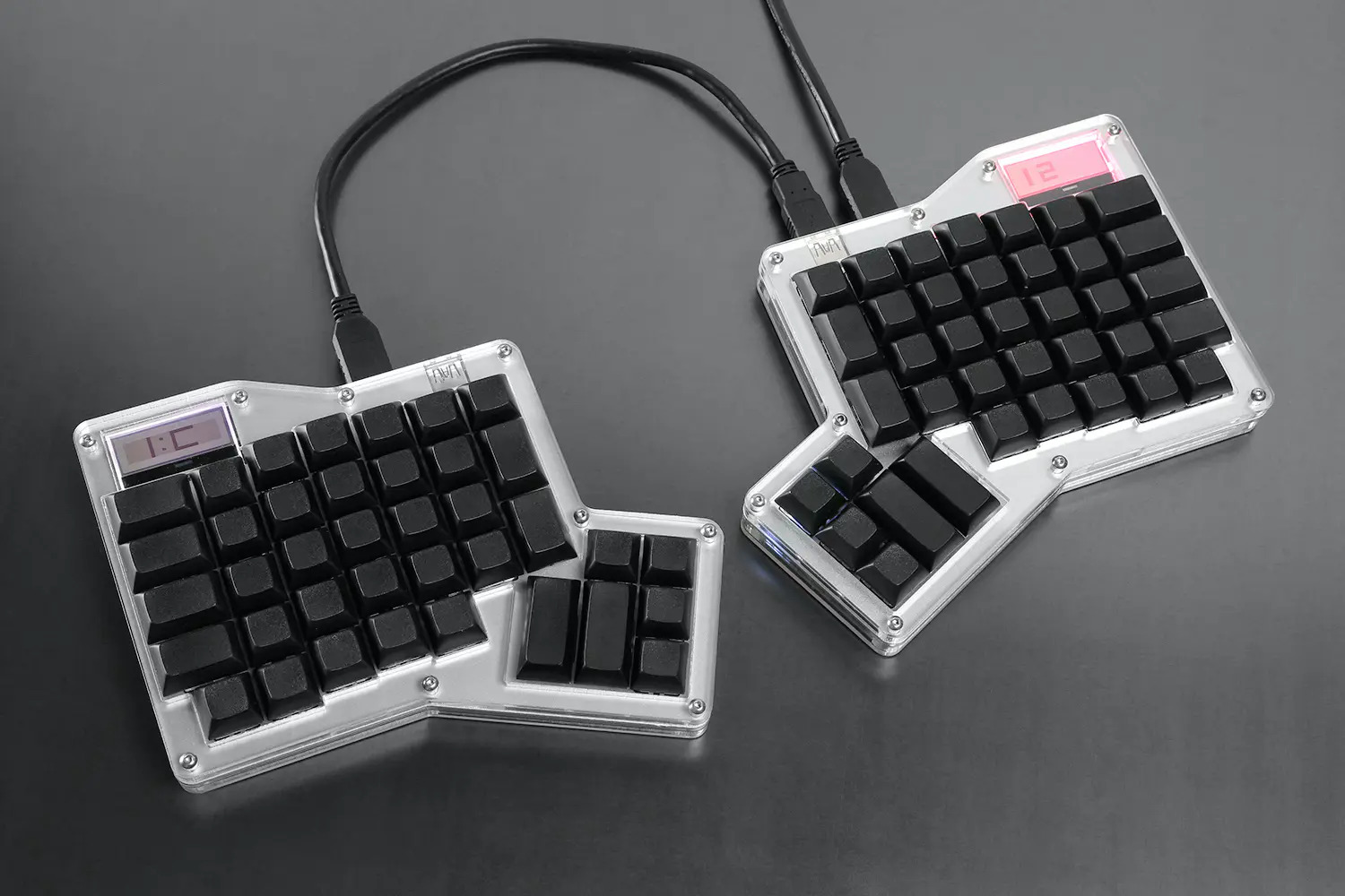 a picture of the Infinity Ergodox split keyboard, with blank keycaps